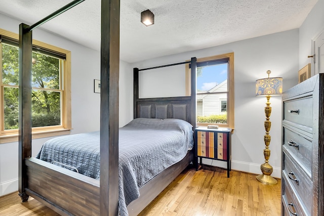 517 Drake Ave, Nashville, TN 37211 - bedroom featuring light wood-style flooring, baseboards, and a textured ceiling
