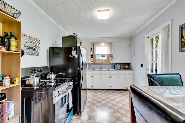 517 Drake Ave, Nashville, TN 37211 - kitchen featuring electric stove, light floors, healthy amount of natural light, crown molding, and white cabinets