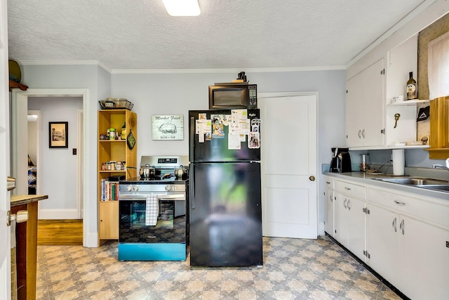 517 Drake Ave, Nashville, TN 37211 - kitchen with black appliances, a sink, light flooring, white cabinets, and crown molding