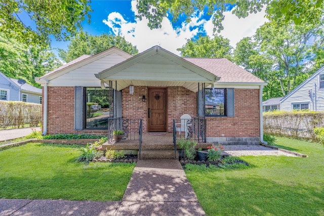 517 Drake Ave, Nashville, TN 37211 - bungalow featuring brick siding, a front lawn, and covered porch