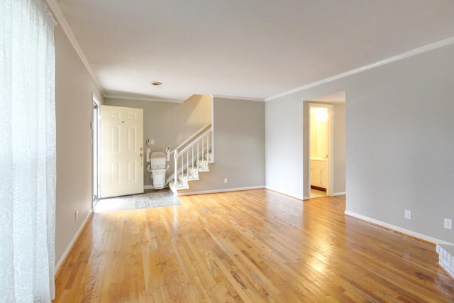 2172 Memorial Dr Unit C3, Clarksville, TN 37043 - unfurnished room with crown molding, stairs, light wood finished floors, and baseboards