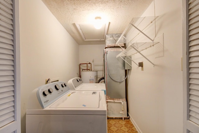 2172 Memorial Dr Unit C3, Clarksville, TN 37043 - laundry room featuring washer and dryer, electric water heater, a textured ceiling, attic access, and light floors