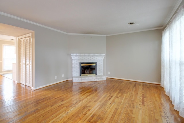 2172 Memorial Dr Unit C3, Clarksville, TN 37043 - unfurnished living room featuring wood finished floors, crown molding, baseboards, and a brick fireplace