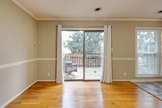2172 Memorial Dr Unit C3, Clarksville, TN 37043 - doorway with light wood-type flooring, crown molding, and baseboards