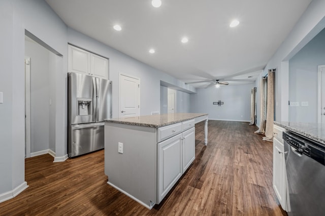 474 Parmley Dr, Nashville, TN 37207 - kitchen with stainless steel appliances, white cabinets, a center island, ceiling fan, and light stone countertops