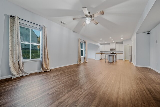 474 Parmley Dr, Nashville, TN 37207 - unfurnished living room featuring wood finished floors, a ceiling fan, baseboards, and recessed lighting