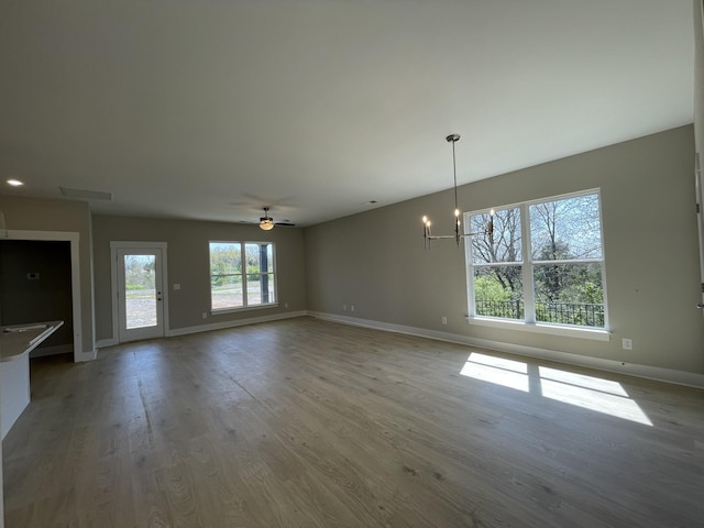 132 Lightberry Ln, Hendersonville, TN 37075 - unfurnished living room featuring a chandelier, baseboards, wood finished floors, and ceiling fan