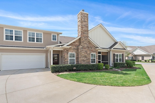 2139 Stonecenter Ln, Murfreesboro, TN 37128 - view of front facade featuring board and batten siding, concrete driveway, a front lawn, an attached garage, and a chimney