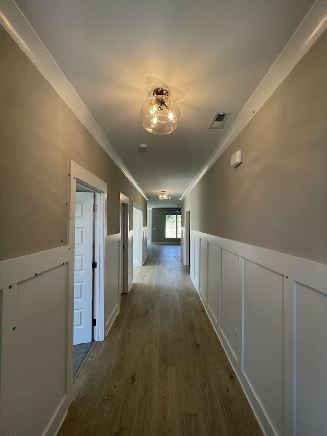 121 Lightberry Ln, Hendersonville, TN 37075 - hall with dark wood finished floors, crown molding, a wainscoted wall, and a decorative wall