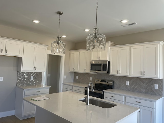 121 Lightberry Ln, Hendersonville, TN 37075 - kitchen featuring stainless steel appliances, a sink, backsplash, white cabinetry, and recessed lighting