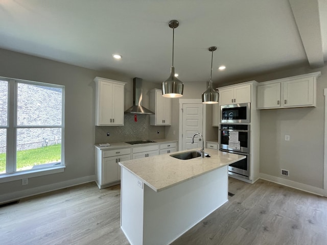 224 Settlers Way, Hendersonville, TN 37075 - kitchen with wall chimney range hood, a sink, appliances with stainless steel finishes, light wood-style flooring, and white cabinets