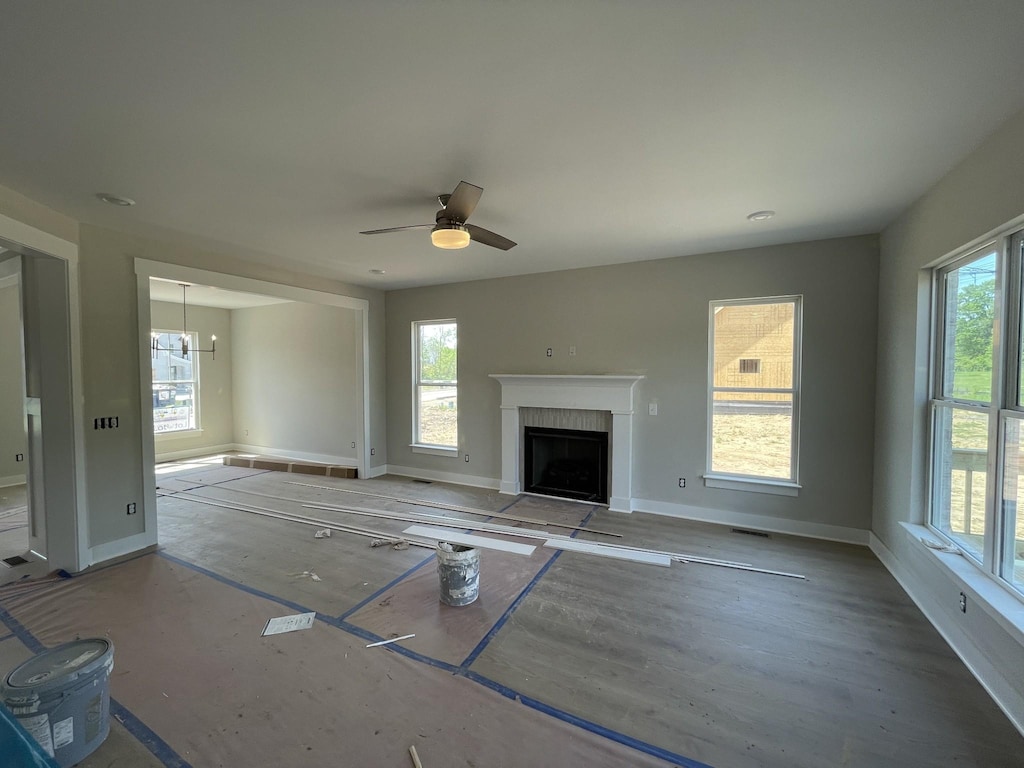 112 Hayden Ln, Gallatin, TN 37066 - unfurnished living room featuring baseboards, a fireplace, and ceiling fan