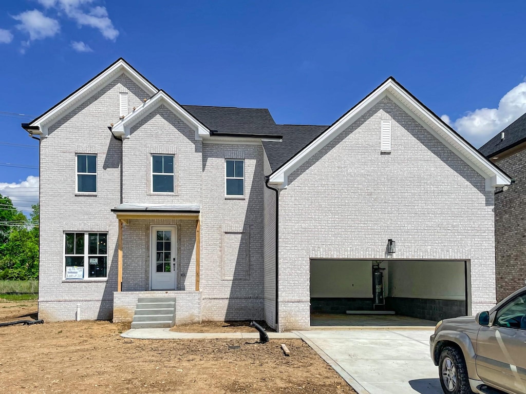 112 Hayden Ln, Gallatin, TN 37066 - view of front of house with concrete driveway and brick siding