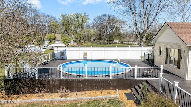 view of pool with fence