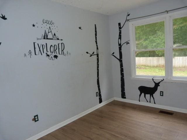 114 Bruce St, Huntland, TN 37345 - empty room featuring wood finished floors and baseboards
