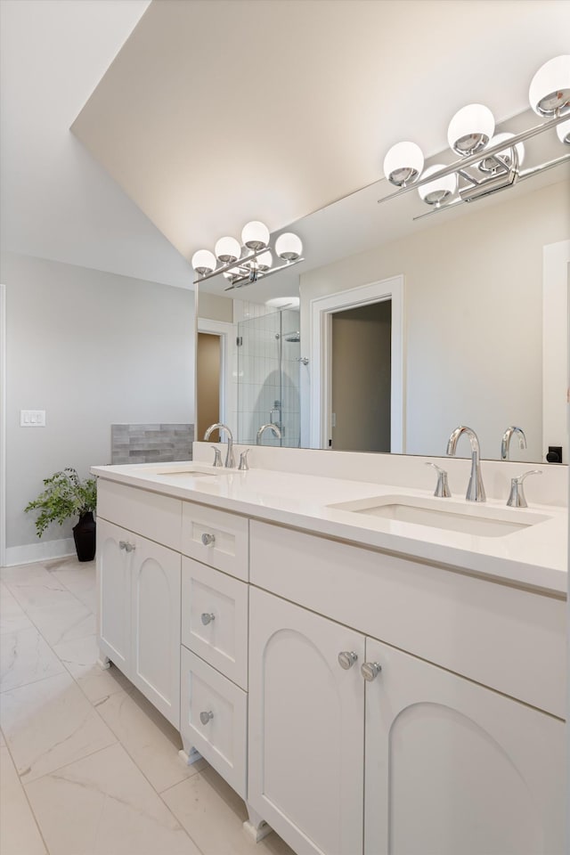 1908 Beechwood Ave, Nashville, TN 37212 - bathroom featuring a chandelier, marble look tiles, a shower stall, and double vanity