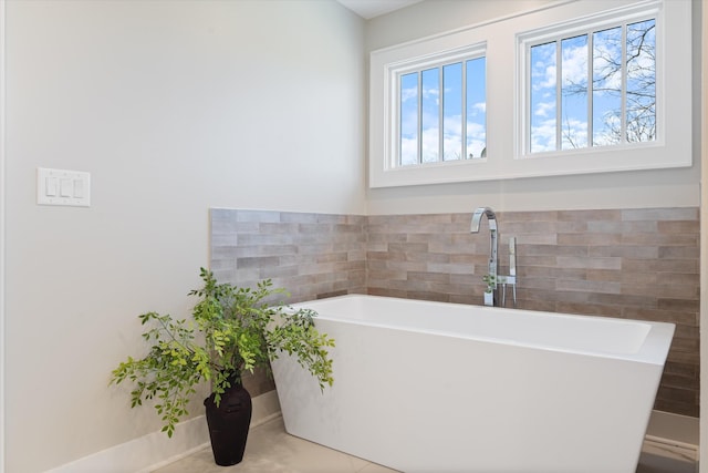 1908 Beechwood Ave, Nashville, TN 37212 - full bathroom with a soaking tub, tile walls, and tile patterned floors