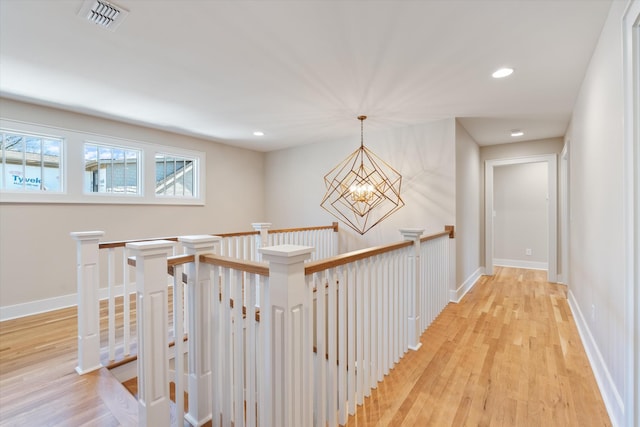 1908 Beechwood Ave, Nashville, TN 37212 - hallway with a chandelier, light wood-style floors, an upstairs landing, baseboards, and recessed lighting