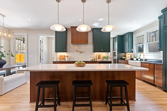 1908 Beechwood Ave, Nashville, TN 37212 - kitchen featuring backsplash, light wood-style floors, a sink, stainless steel double oven, and recessed lighting