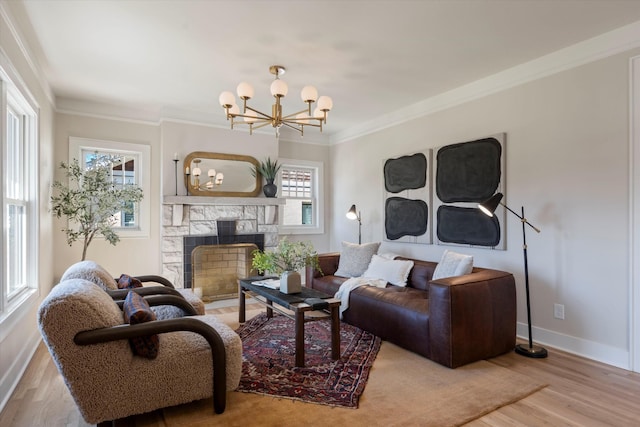1908 Beechwood Ave, Nashville, TN 37212 - living area with ornamental molding, wood finished floors, baseboards, a chandelier, and a fireplace