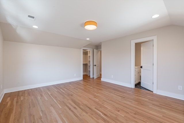 1908 Beechwood Ave, Nashville, TN 37212 - unfurnished bedroom featuring lofted ceiling, light wood finished floors, baseboards, a spacious closet, and recessed lighting