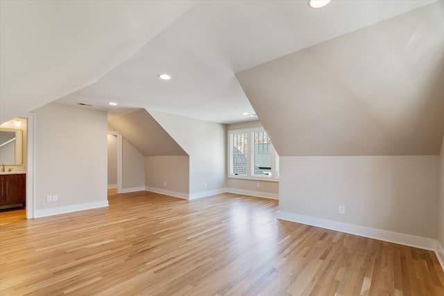 1908 Beechwood Ave, Nashville, TN 37212 - additional living space with lofted ceiling, recessed lighting, light wood-style flooring, baseboards, and a sink