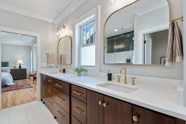 1908 Beechwood Ave, Nashville, TN 37212 - full bathroom with double vanity, a shower with shower door, tile patterned flooring, crown molding, and ensuite bath