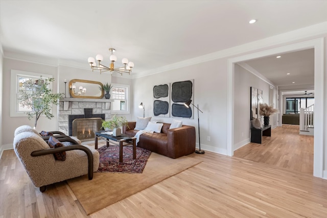 1908 Beechwood Ave, Nashville, TN 37212 - living area with ornamental molding, wood finished floors, a chandelier, baseboards, and a fireplace