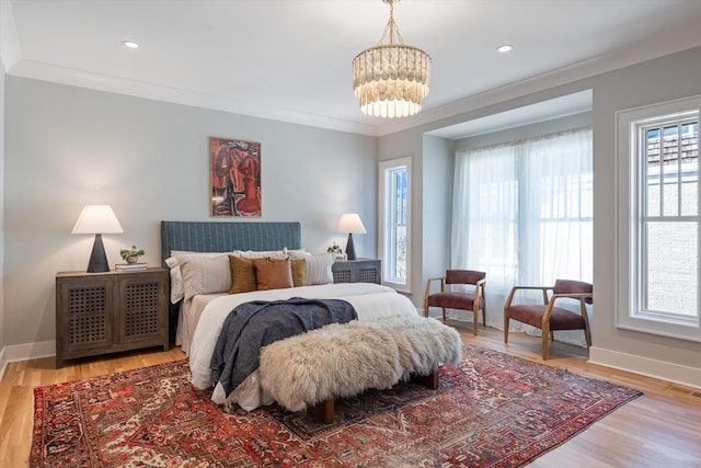 1908 Beechwood Ave, Nashville, TN 37212 - bedroom with multiple windows, a chandelier, ornamental molding, light wood finished floors, and baseboards