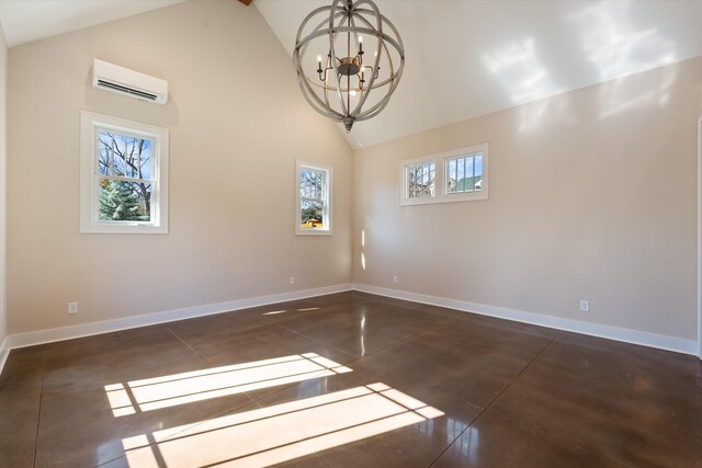 1908 Beechwood Ave, Nashville, TN 37212 - unfurnished room featuring a wall unit AC, a chandelier, high vaulted ceiling, and baseboards