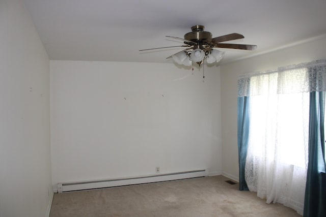 spare room featuring a baseboard heating unit, light colored carpet, and ceiling fan