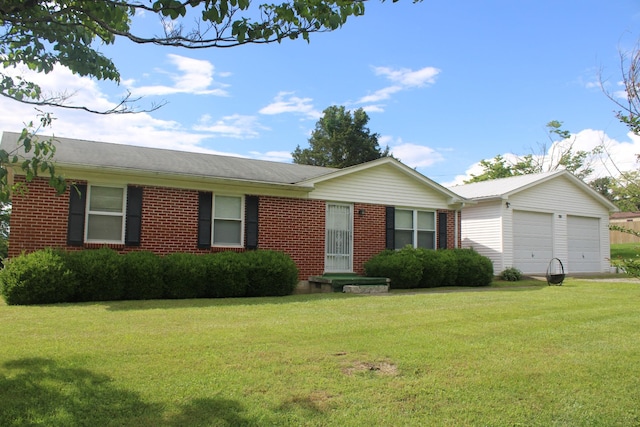 ranch-style house featuring a front yard, brick siding, and an attached garage