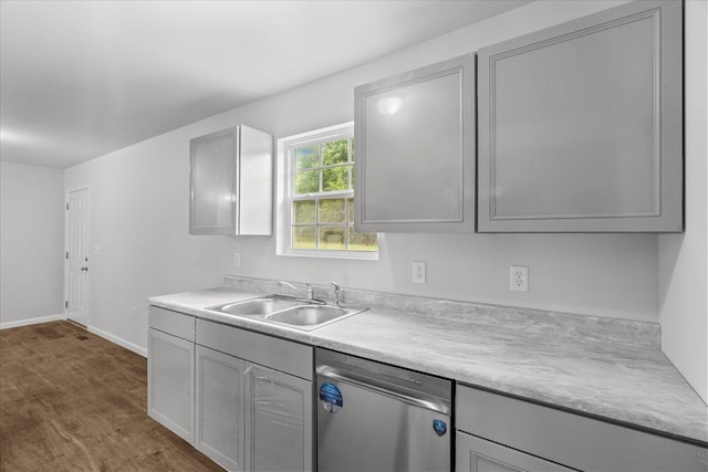 674 Eber Rd, Dalton, GA 30720 - kitchen featuring stainless steel dishwasher, a sink, dark wood-type flooring, and light countertops