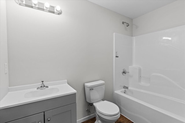 674 Eber Rd, Dalton, GA 30720 - bathroom with toilet, vanity, wood finished floors, and bathing tub / shower combination