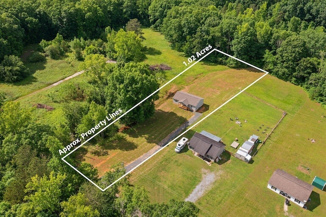 674 Eber Rd, Dalton, GA 30720 - aerial view of property and surrounding area with property parcel outlined and a forest