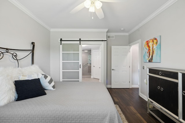 3201 Aspen Grove Dr Unit F4, Franklin, TN 37067 - bedroom featuring ornamental molding, wood finished floors, a barn door, baseboards, and ensuite bathroom