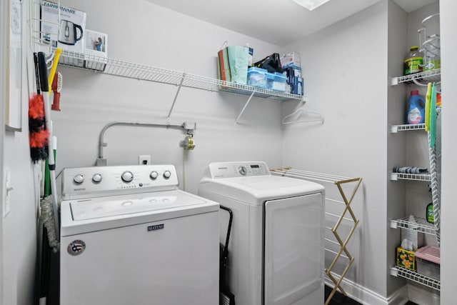 3201 Aspen Grove Dr Unit F4, Franklin, TN 37067 - laundry area with washer and clothes dryer and baseboards