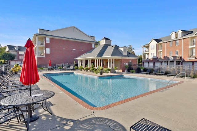 3201 Aspen Grove Dr Unit F4, Franklin, TN 37067 - community pool with fence, a patio, and a residential view