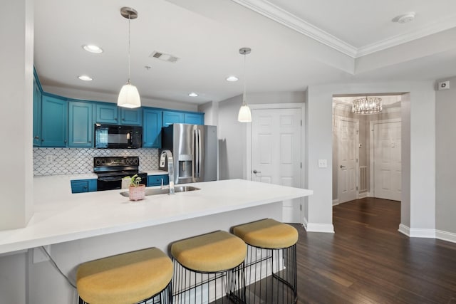 3201 Aspen Grove Dr Unit F4, Franklin, TN 37067 - kitchen featuring black appliances, blue cabinets, a peninsula, ornamental molding, and baseboards