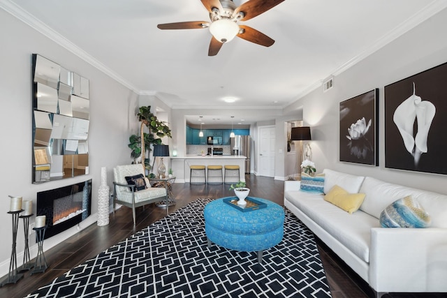 3201 Aspen Grove Dr Unit F4, Franklin, TN 37067 - living area with ornamental molding, ceiling fan, dark wood-type flooring, a glass covered fireplace, and baseboards