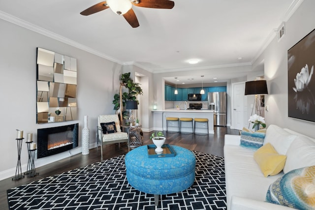 3201 Aspen Grove Dr Unit F4, Franklin, TN 37067 - living room featuring dark wood-type flooring, ornamental molding, ceiling fan, a glass covered fireplace, and baseboards