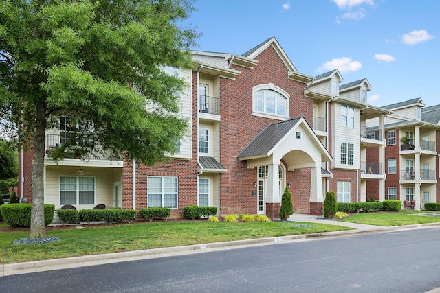 3201 Aspen Grove Dr Unit F4, Franklin, TN 37067 - view of property with brick siding and a front lawn