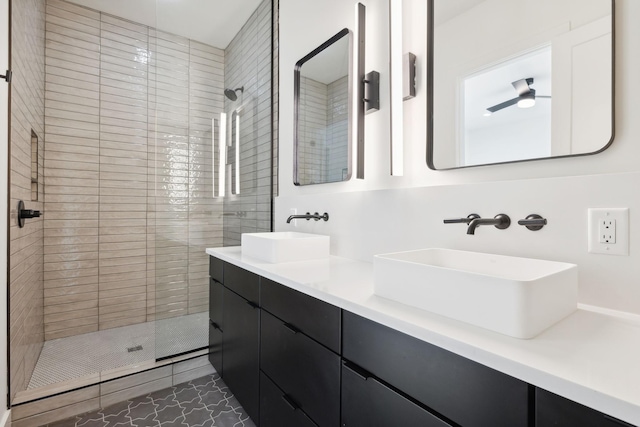 full bathroom featuring a shower stall and double vanity