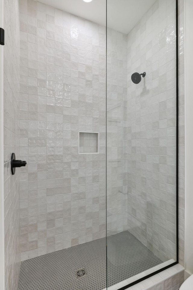 full bathroom with a tile shower