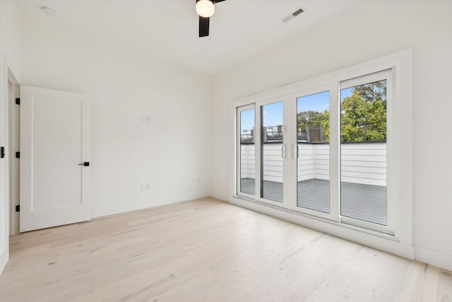 unfurnished room featuring light wood-style floors and a ceiling fan