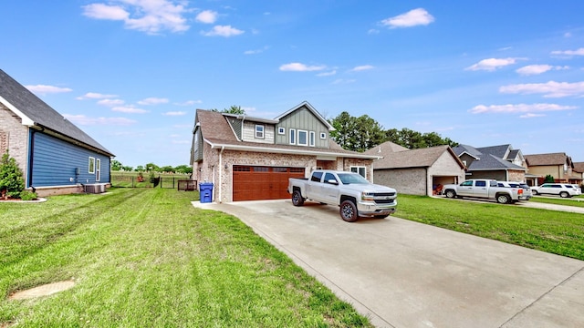 788 Jersey Dr, Clarksville, TN 37043 - view of front facade with brick siding, central air condition unit, a front yard, driveway, and an attached garage
