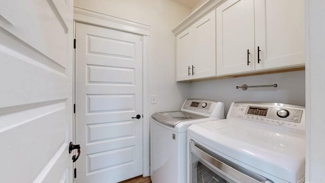 788 Jersey Dr, Clarksville, TN 37043 - clothes washing area featuring washer and clothes dryer and cabinet space
