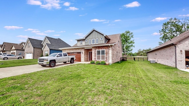 788 Jersey Dr, Clarksville, TN 37043 - view of front facade with an attached garage, driveway, brick siding, and board and batten siding