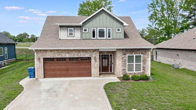 788 Jersey Dr, Clarksville, TN 37043 - view of front facade featuring concrete driveway, board and batten siding, brick siding, an attached garage, and roof with shingles