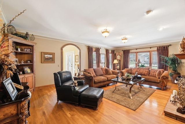 1001 Williams Way, Old Hickory, TN 37138 - living room with arched walkways, wood finished floors, crown molding, and baseboards